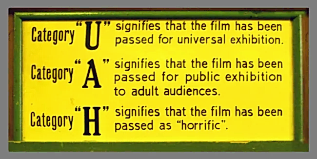A sign explaining three defunct rating categories for films: 'U' (universal); 'A' (adult); 'H' (horrific).