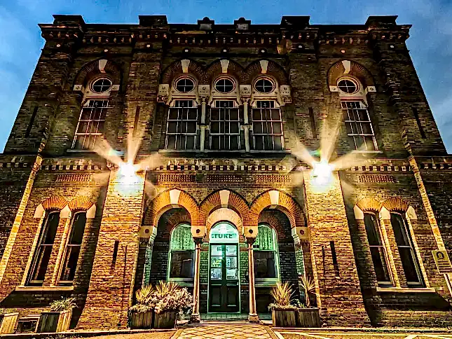 The entrance to the Cinema Museum, shot from a low angle at night.