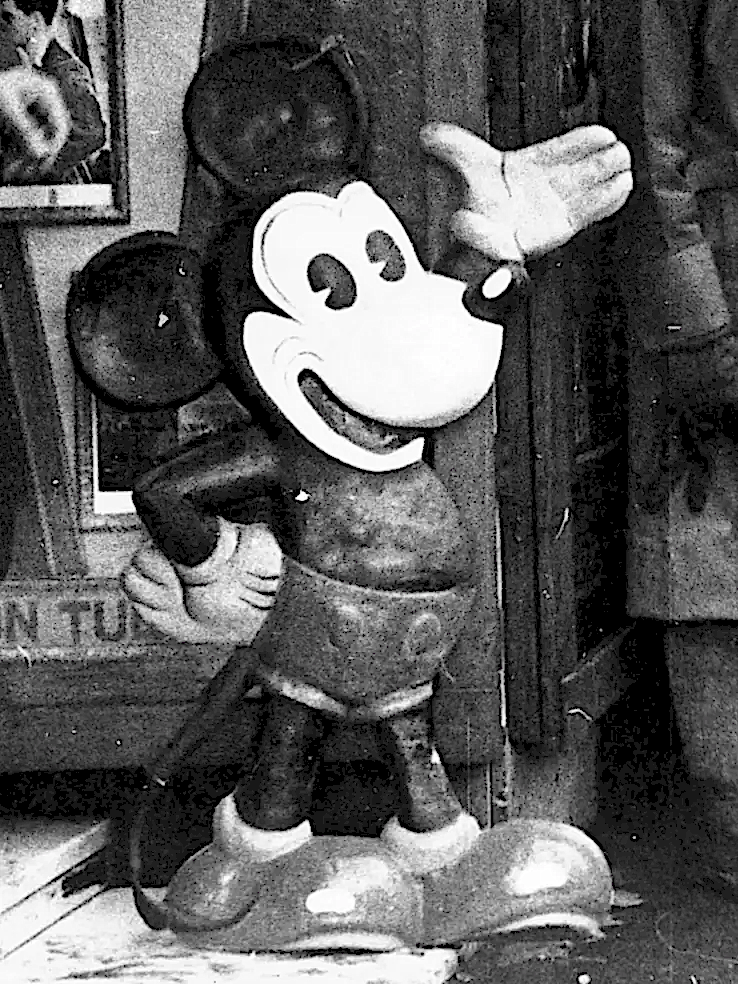 Mickey Mouse standee outside a cinema.